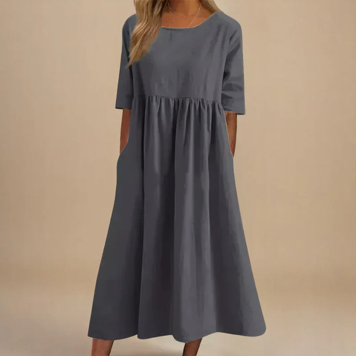 Elegant women's party dress with a flattering flowing silhouette. A comfortable & versatile classic for occasions.
