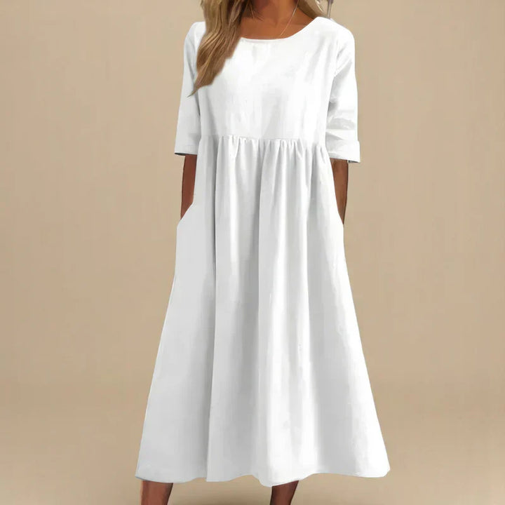 Comfortable women's casual dress, elegant and flattering. Flowing midi design is perfect for everyday style.
