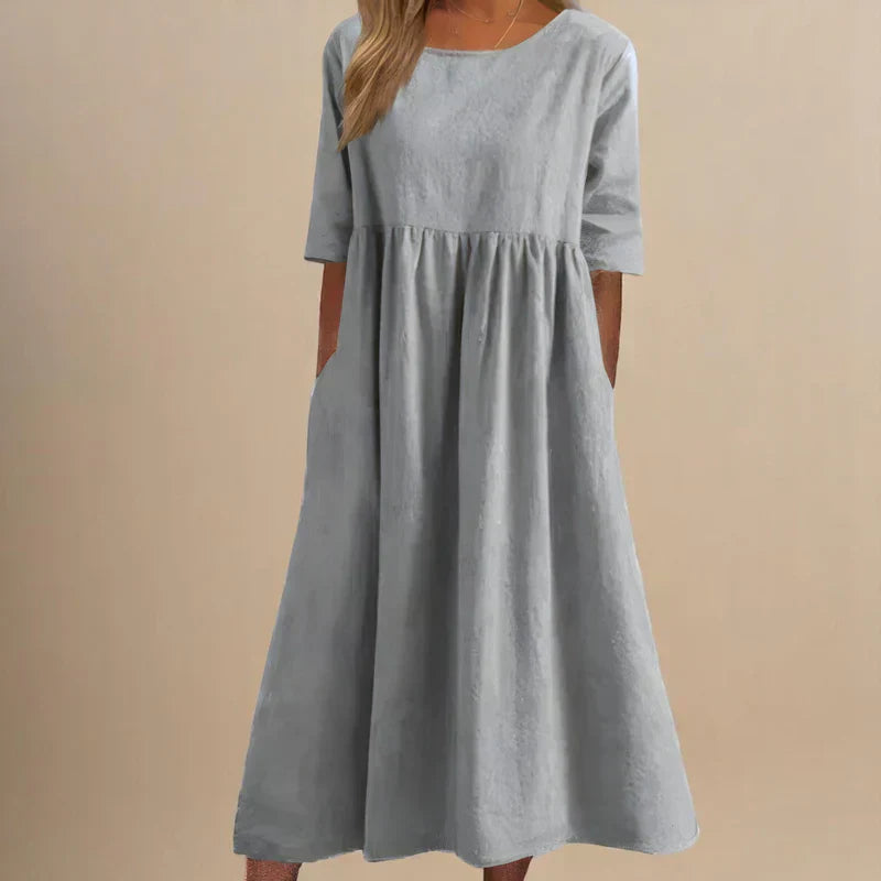 Stylish women's elegant flowing dress, flattering midi length. Versatile for party, summer, or casual occasions.