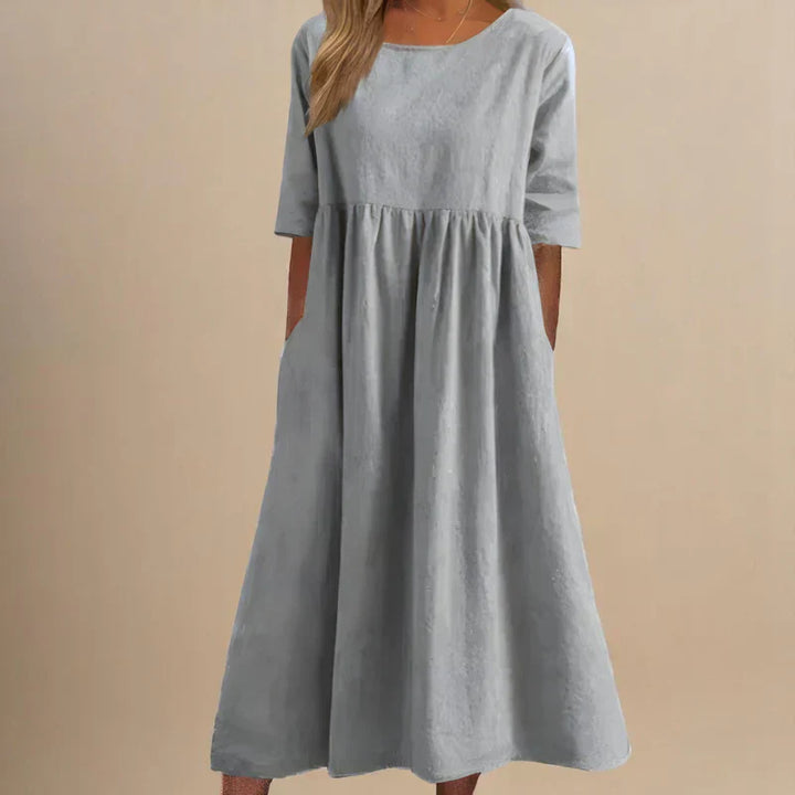 Stylish women's elegant flowing dress, flattering midi length. Versatile for party, summer, or casual occasions.