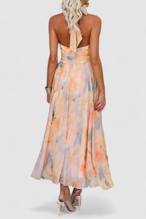 Stylish women's halter neck maxi dress with vibrant floral print. Comfortable sleeveless design for summer elegance.