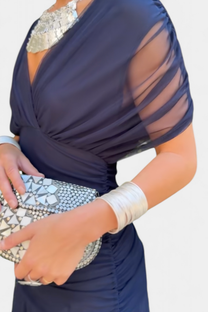 Women's elegant floral off-shoulder dress, long maxi length, ideal for sophisticated occasion wear.
