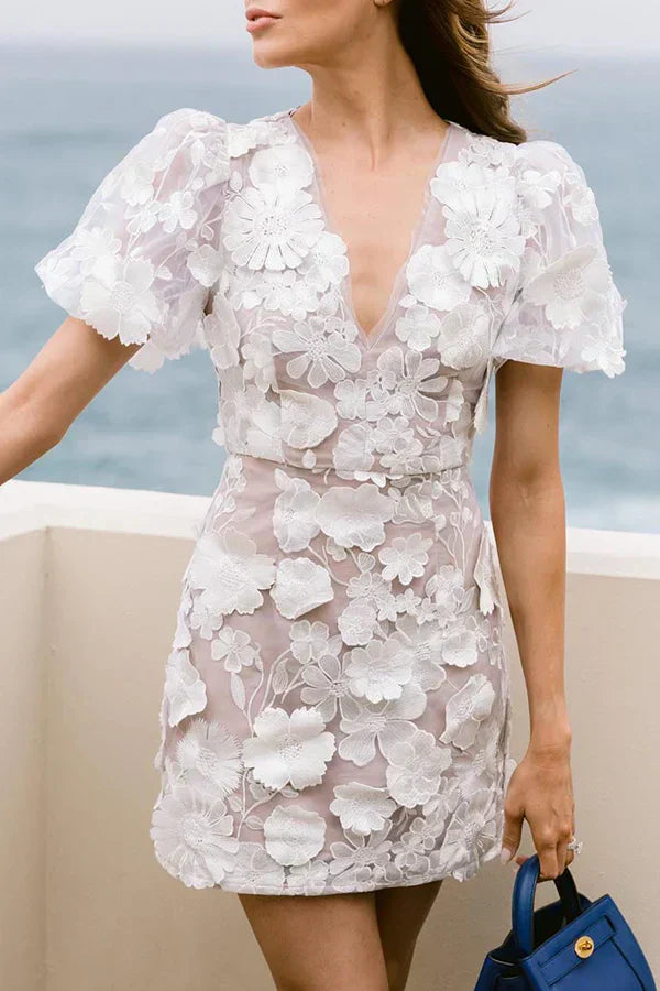 Flared floral mini dress for women, an elegant choice for summer fashion. Embroidered details.