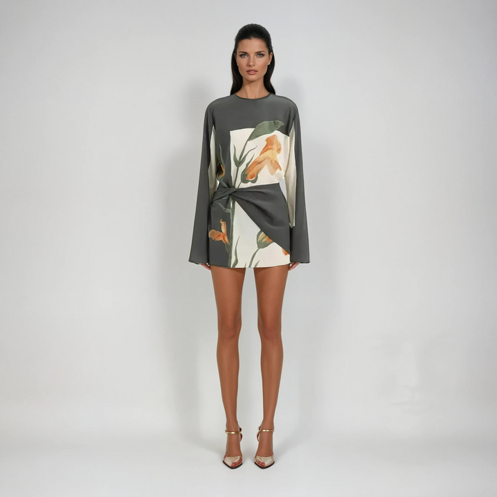 Flattering women's floral mini cocktail dress with a trendy twist front and elegant flared sleeves.