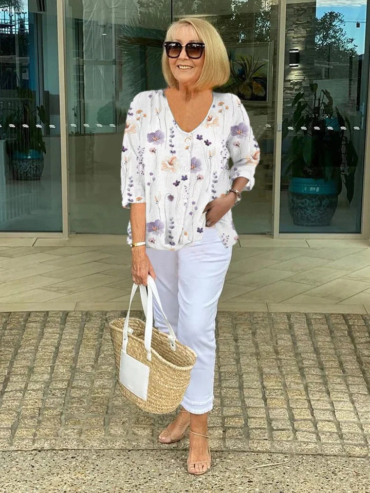 Comfortable loose fit women's top with elegant floral print. Ideal for spring and summer casual wear.