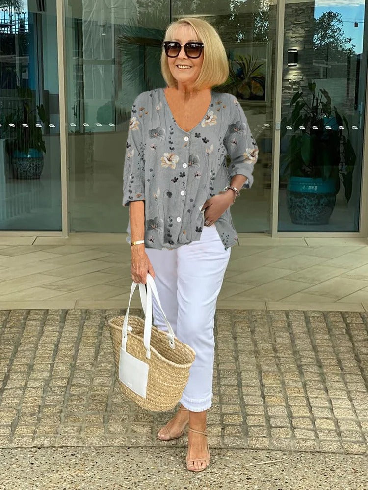 Stylish ladies blouse: vibrant floral print, elegant design for women. Spring/summer fashion top.