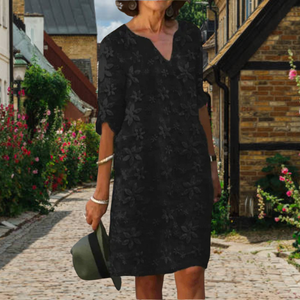 Comfortable plus size women's floral v-neck dress, elegant half-sleeve design for versatile casual and work occasions.