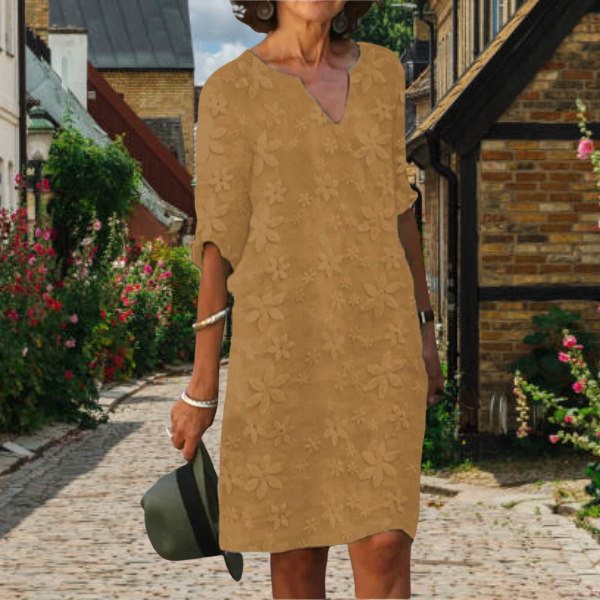 Beautiful floral v-neck dress for women, featuring half sleeves and a comfortable, elegant design for versatile wear.