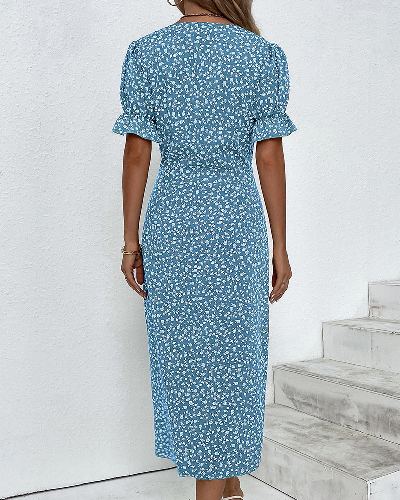 Elegant women's flowy midi dress in a charming floral print, featuring a classic V-neck, versatile for spring/summer.