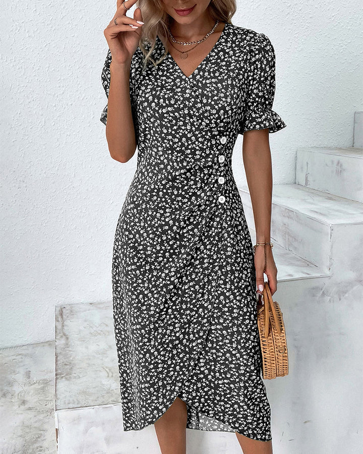 Women's elegant V-neck midi dress featuring a vibrant floral pattern, perfect for spring and summer casual wear.
