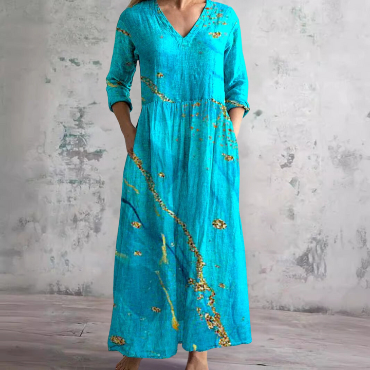 Women's elegant floral V-neck summer dress. Breezy, comfortable, perfect for day wear or vacation.