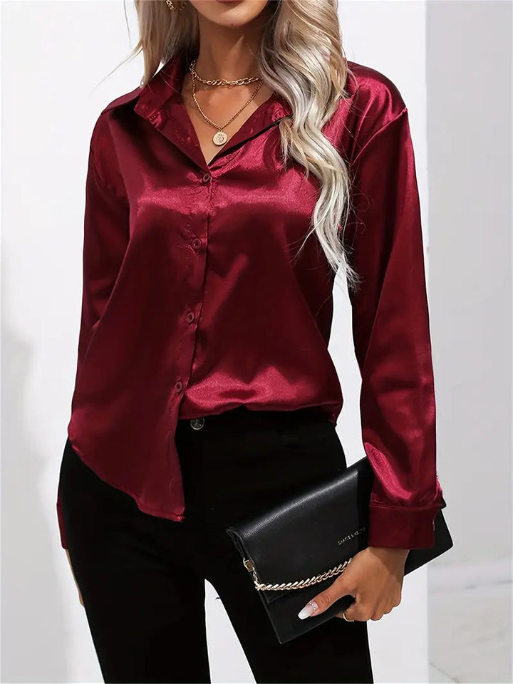 Sophisticated women's work blouse, elegant button-down. Flowy long-sleeve for professional style.