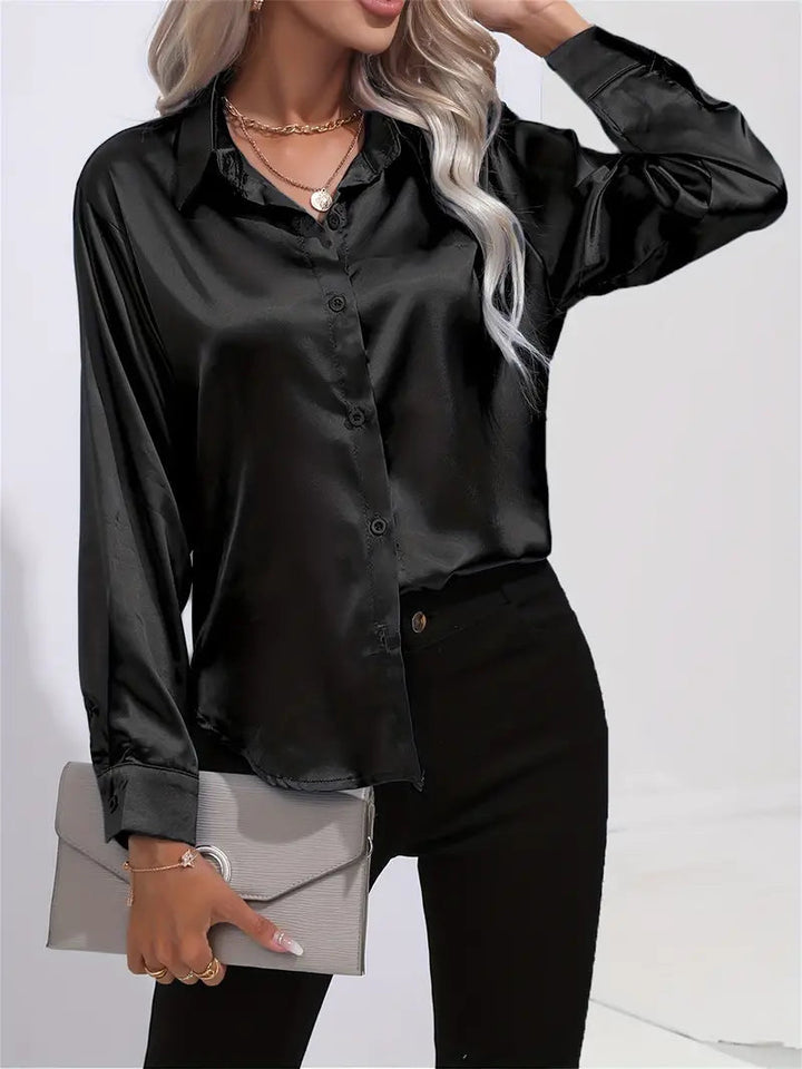 Sophisticated women's button-down blouse, flowy fabric. Versatile for professional or evening events.