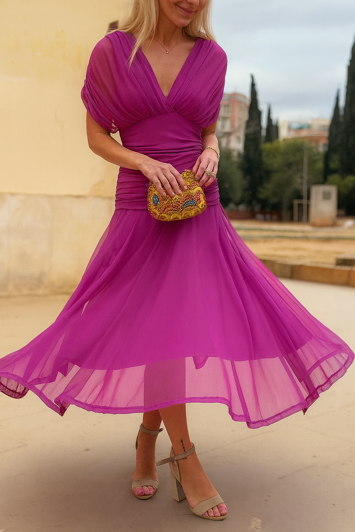 Chic short sleeve flowy maxi dress for women, ideal as a comfortable summer dress or party outfit.