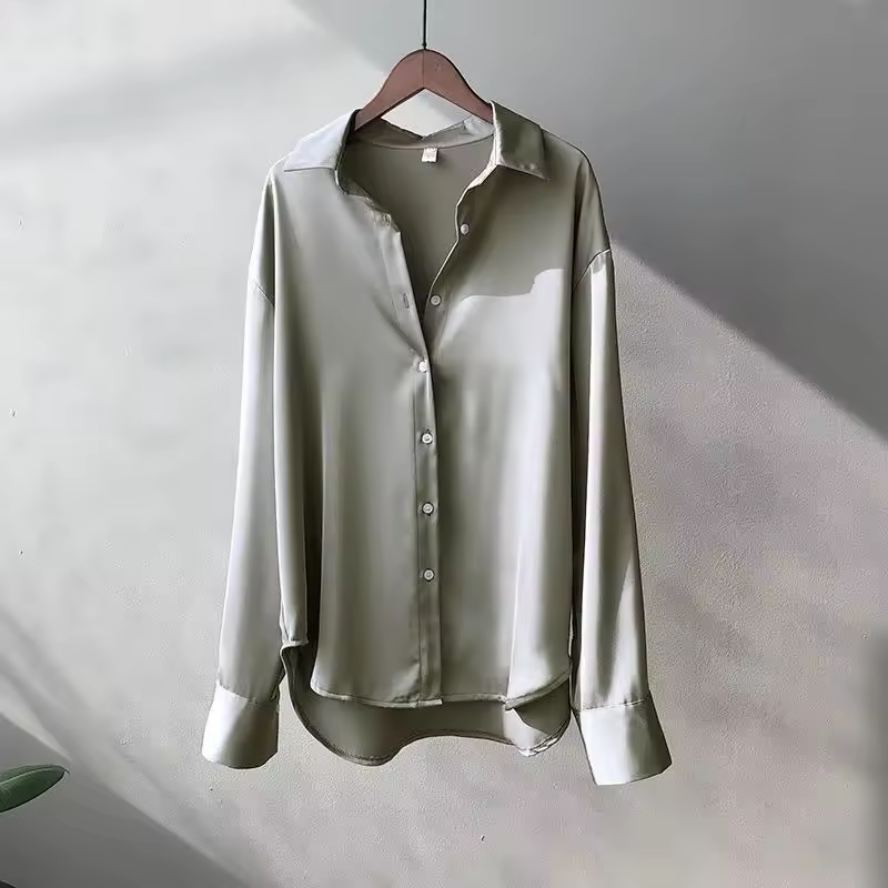Elegant women's flowy summer blouse, a chic and comfortable top for versatile spring and everyday wear.