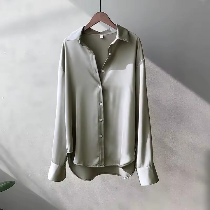 Elegant women's flowy summer blouse, a chic and comfortable top for versatile spring and everyday wear.