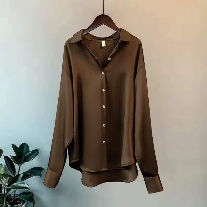 Stylish women's summer blouse, an elegant flowy top offering comfortable wear for various occasions.