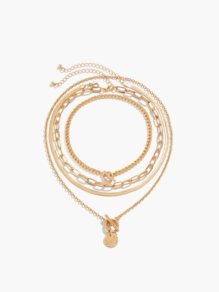 Stylish gold layered necklace set for women with a unique coin pendant, a chic and elegant jewelry piece.