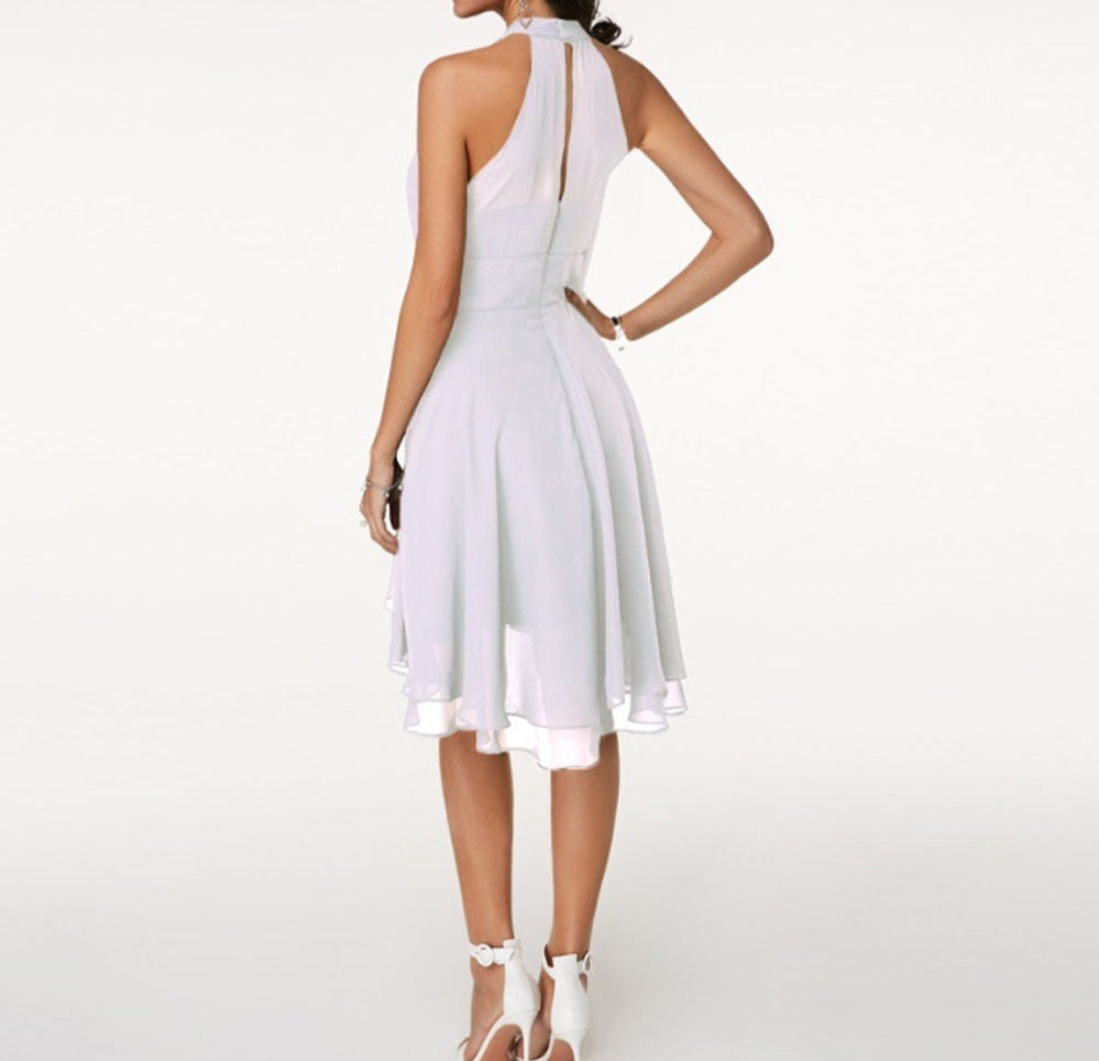 Elegant women's sleeveless midi cocktail dress with a graceful halter neck design.
