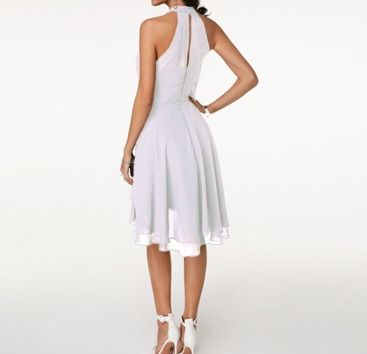 Elegant women's sleeveless midi cocktail dress with a graceful halter neck design.