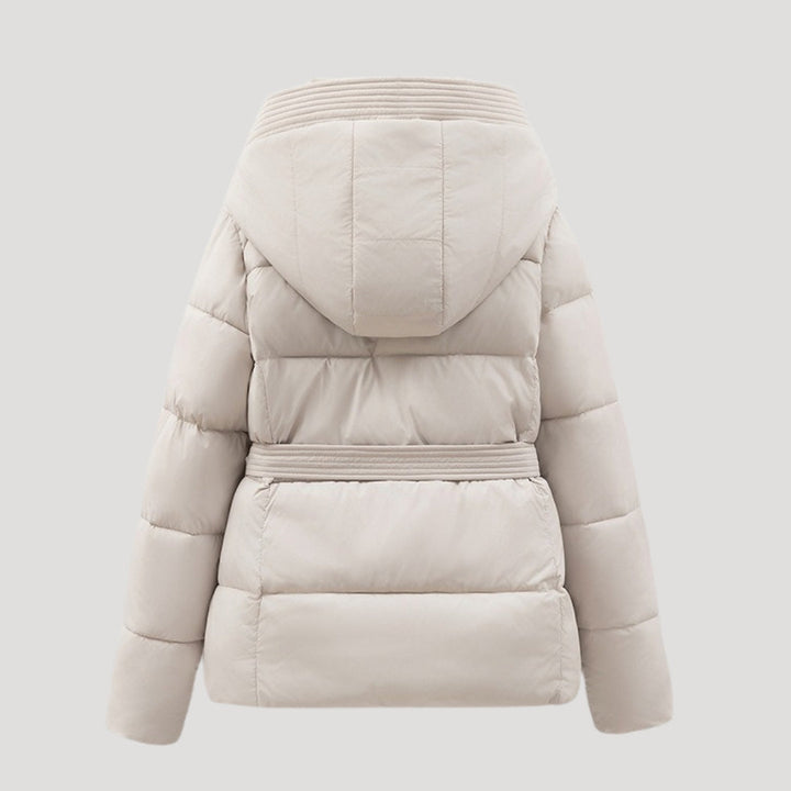 Cozy women's winter puffer jacket, hooded and belted, providing ultimate warmth for cold outdoor style.