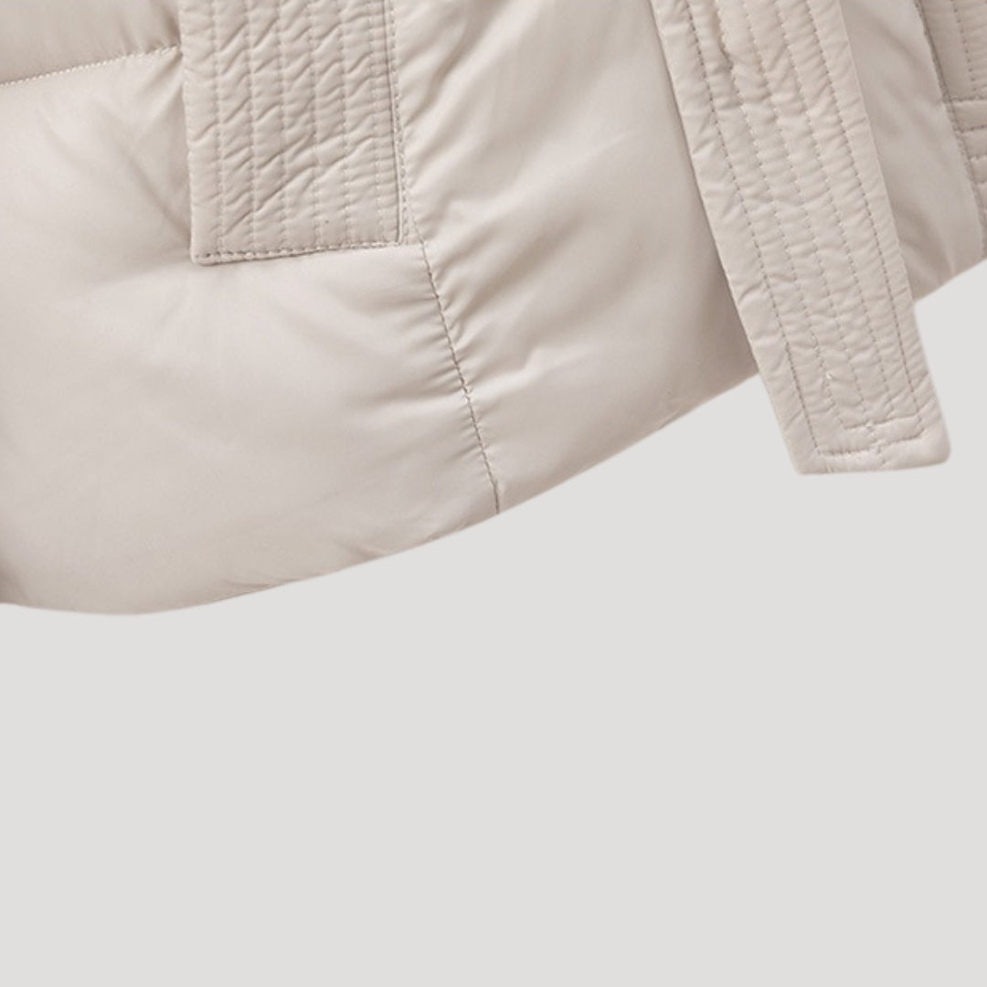 Stylish women's elegant belted puffer jacket with hood for winter, perfect for cold weather fashion.