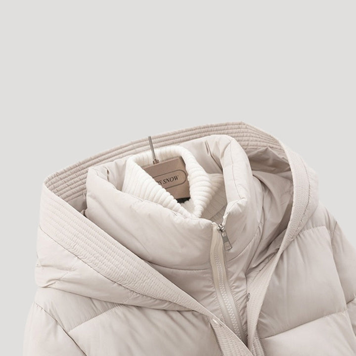Women's warm hooded winter puffer coat, elegant and belted, designed for cozy and fashionable cold weather.