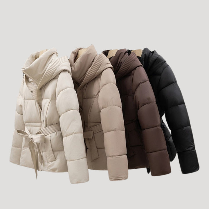 Fashionable women's belted hooded puffer jacket, an elegant winter coat for warmth and style in cold weather.