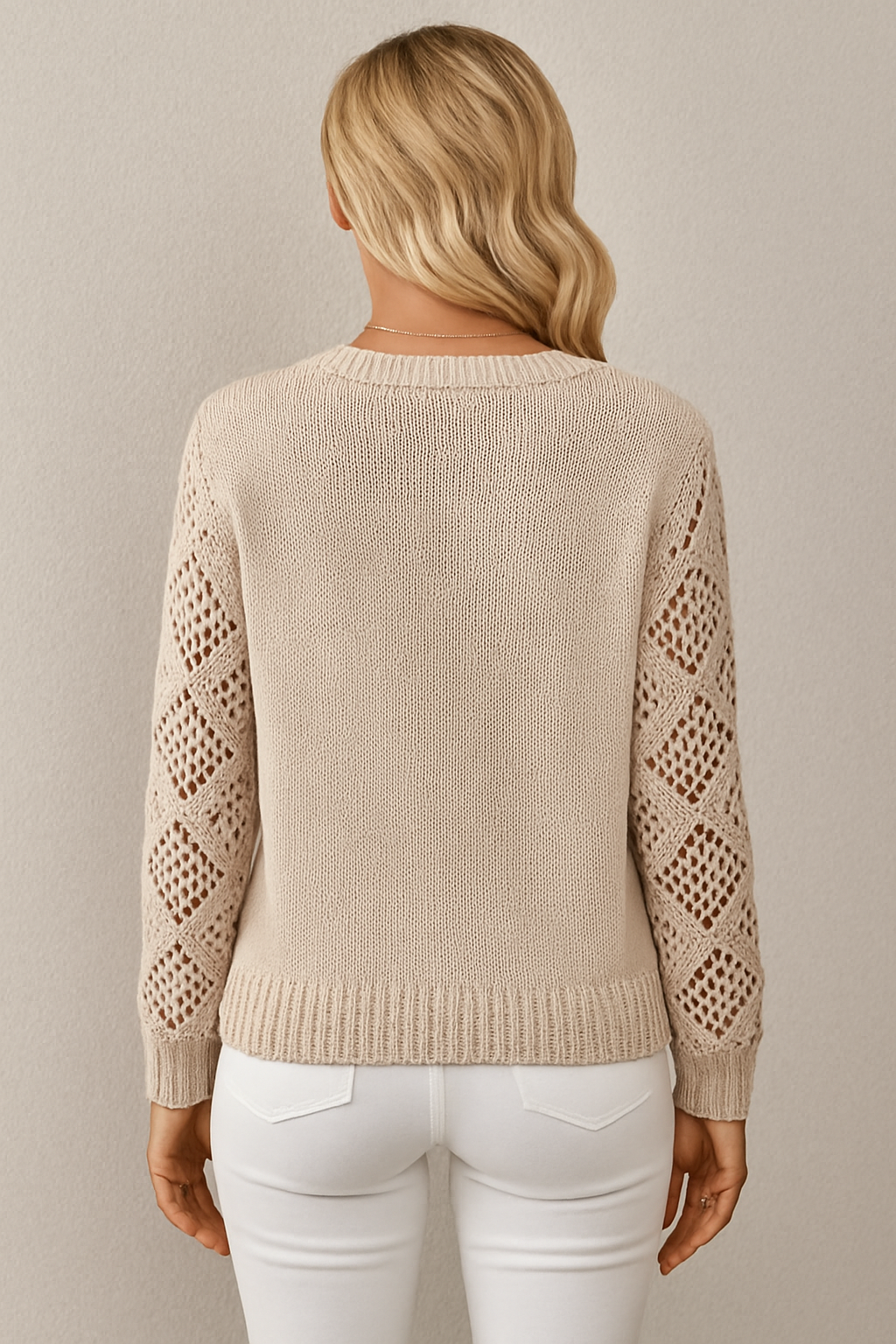 Lightweight women's pullover sweater featuring delicate crochet long sleeves, ideal for transitional weather.