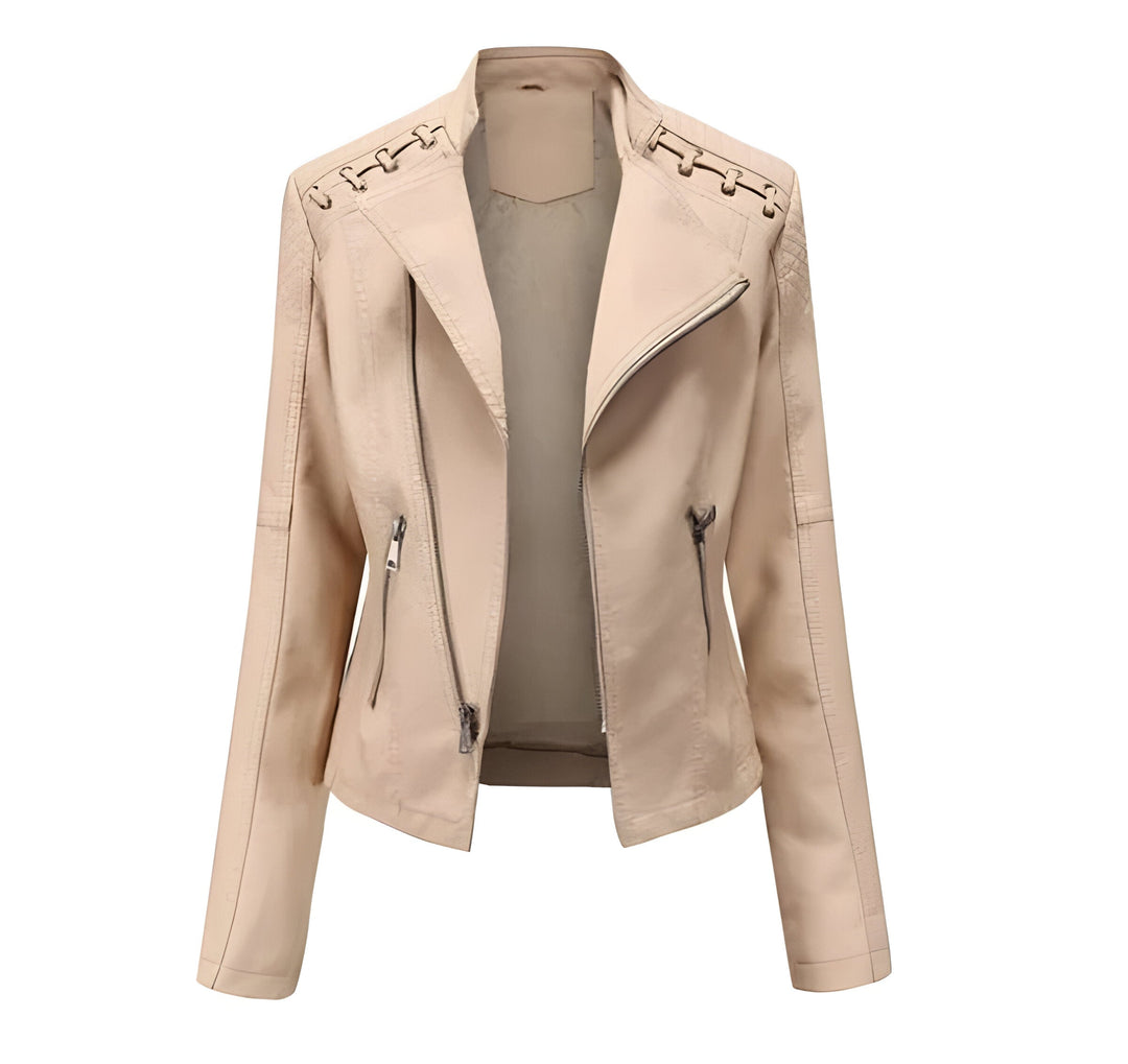 Close-up of soft lambskin leather on women's elegant vintage style jacket, highlighting luxurious texture.