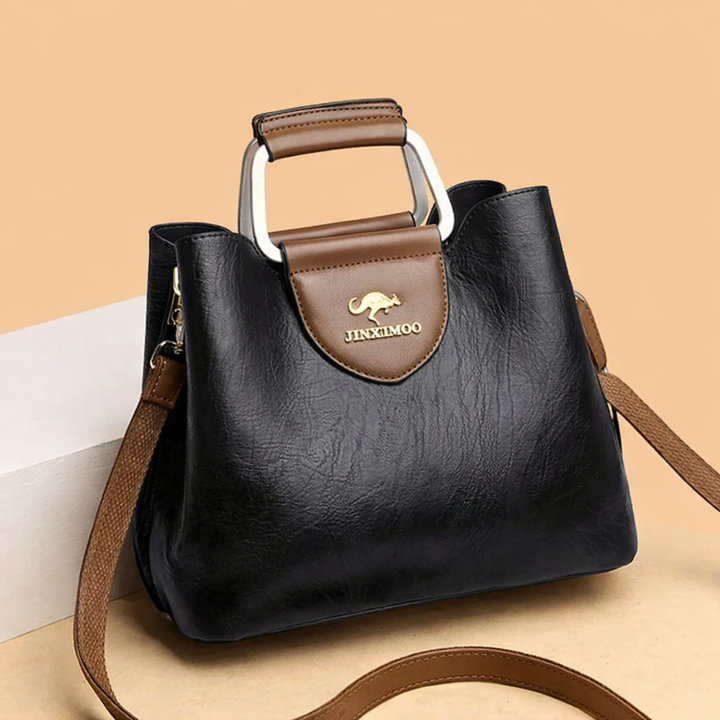 Elegant women's leather shoulder bag with a luxurious finish, perfect for sophisticated everyday fashion.