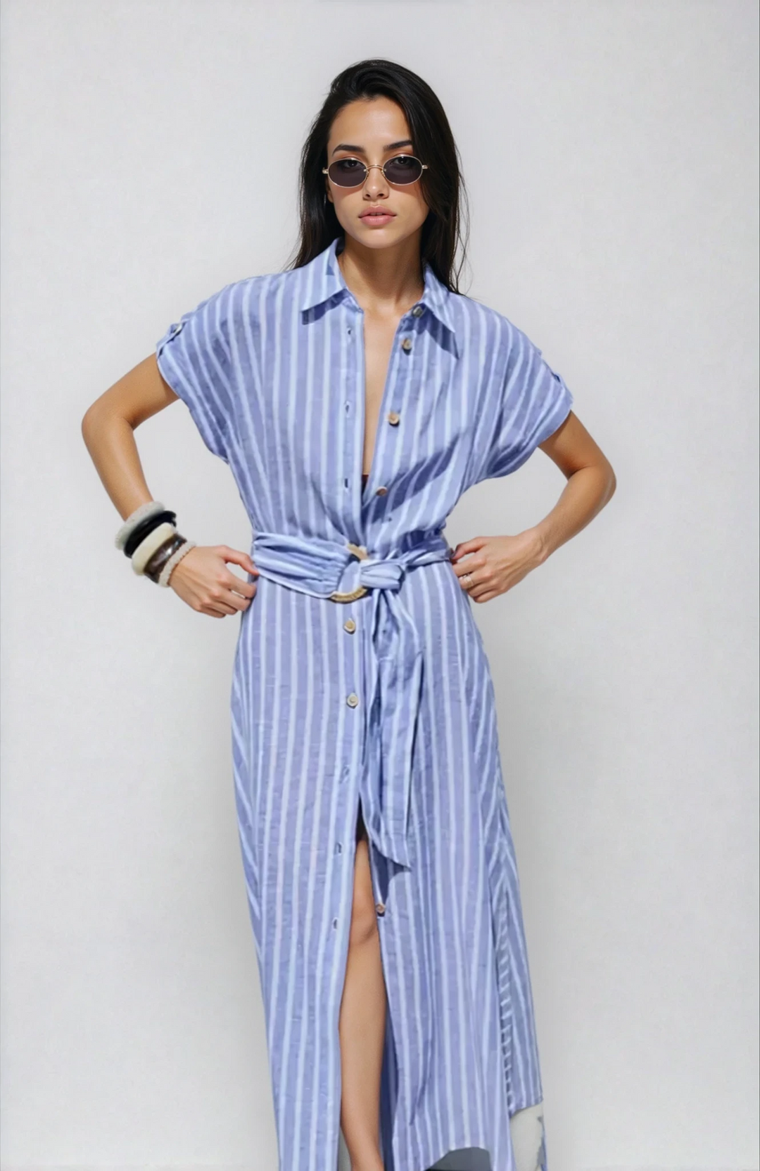 Elegant women's light blue striped belted maxi dress, button-down style, perfect for summer. 