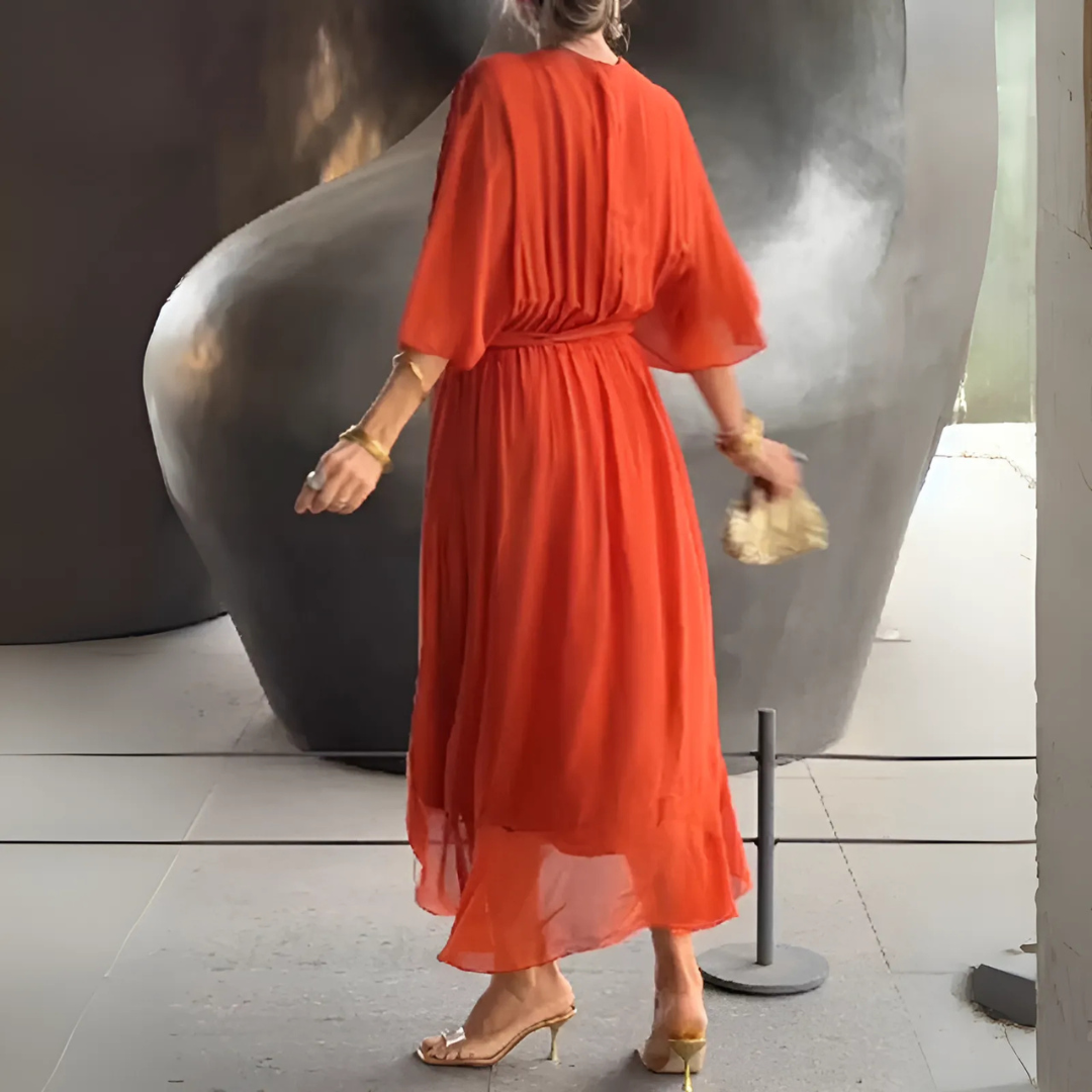 Elegant women's lightweight wrap dress, ideal for summer events. Flowy fabric and adjustable tie.