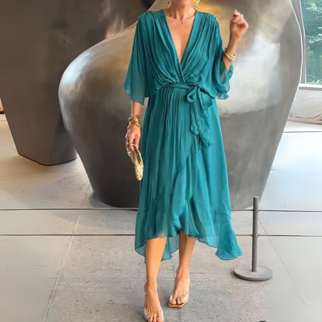 Flattering flowy women's wrap dress, lightweight and elegant. Short-sleeved V-neck design.