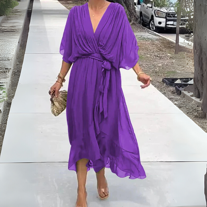 Lightweight women's elegant wrap dress with V-neck and short sleeves. Feminine style for summer.