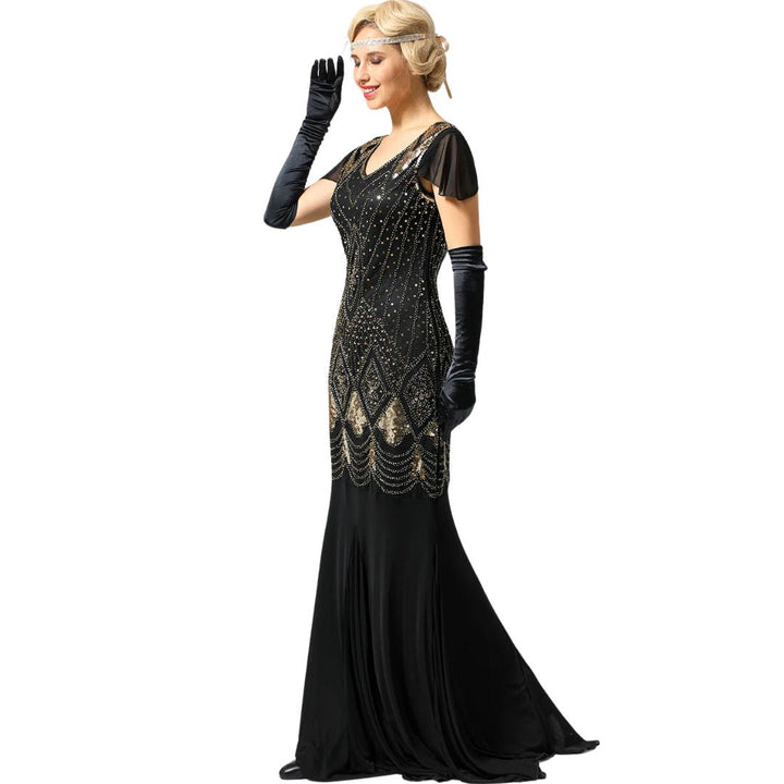 Elegant women's 20s flapper dress featuring a long silhouette and all-over sparkling sequin embellishment.