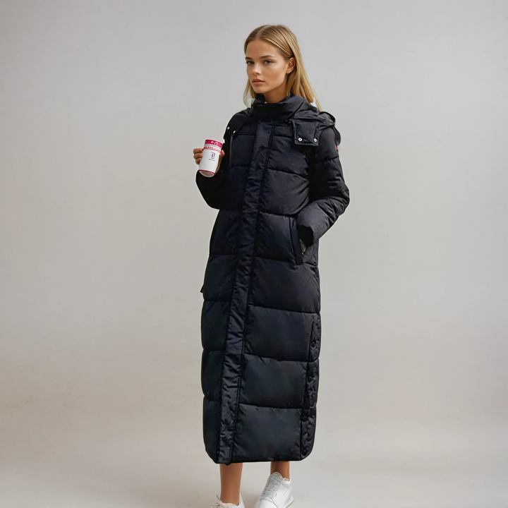 Women's long quilted puffer coat in a sleek design. Stylish and warm winter outerwear for elegant fashion.