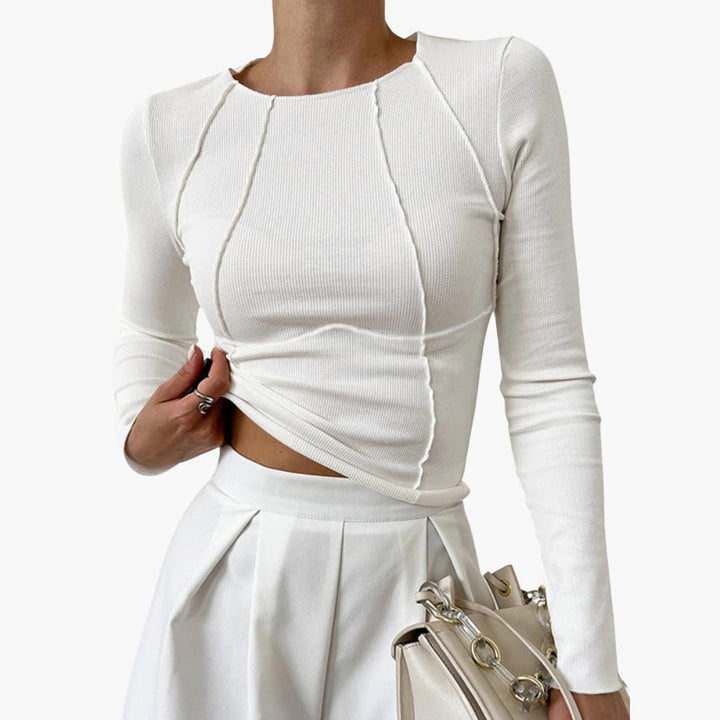Elegant women's long sleeve top with sculpted seams, offering a flattering contoured fit and polished look. Comfortable chic apparel.