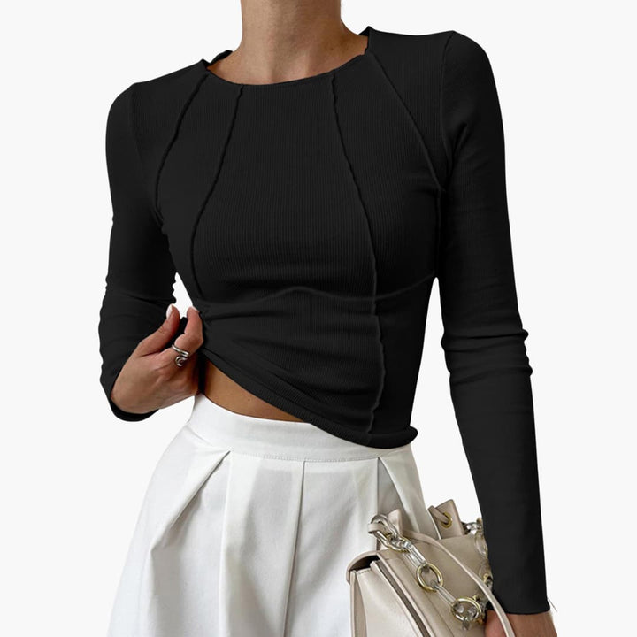 Comfortable women's sculpted long sleeve top, versatile for everyday style. Flattering fit, elegant design.