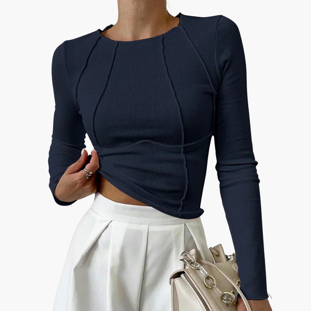Chic women's long sleeve top featuring sculpted seams that enhance a flattering silhouette. Elegant & comfortable.