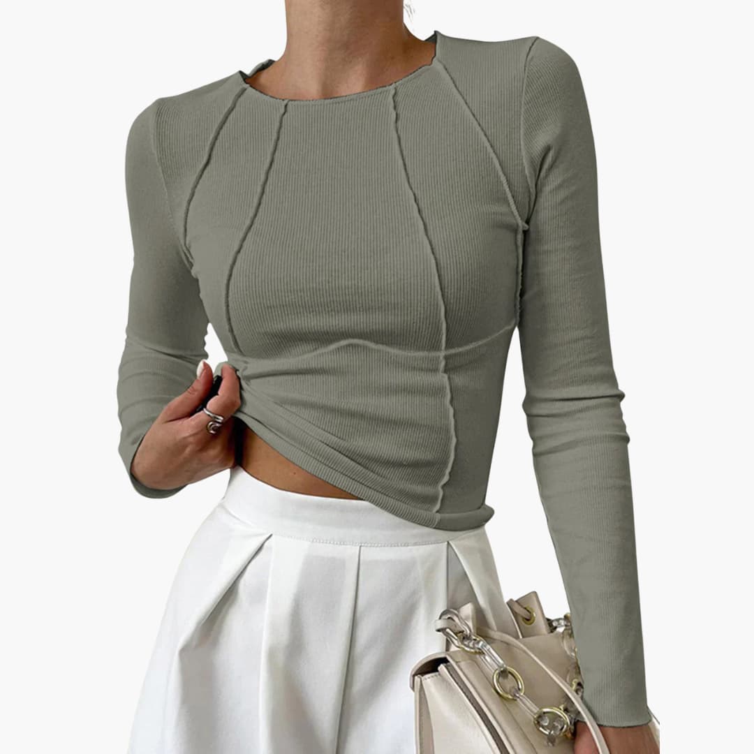 Women's elegant long sleeve top with sculpted contouring seams for a polished, comfortable, and versatile fit.
