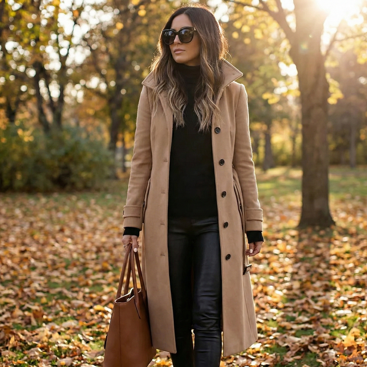 Elegant women's long trench coat. Classic double-breasted design for sophisticated winter outerwear.