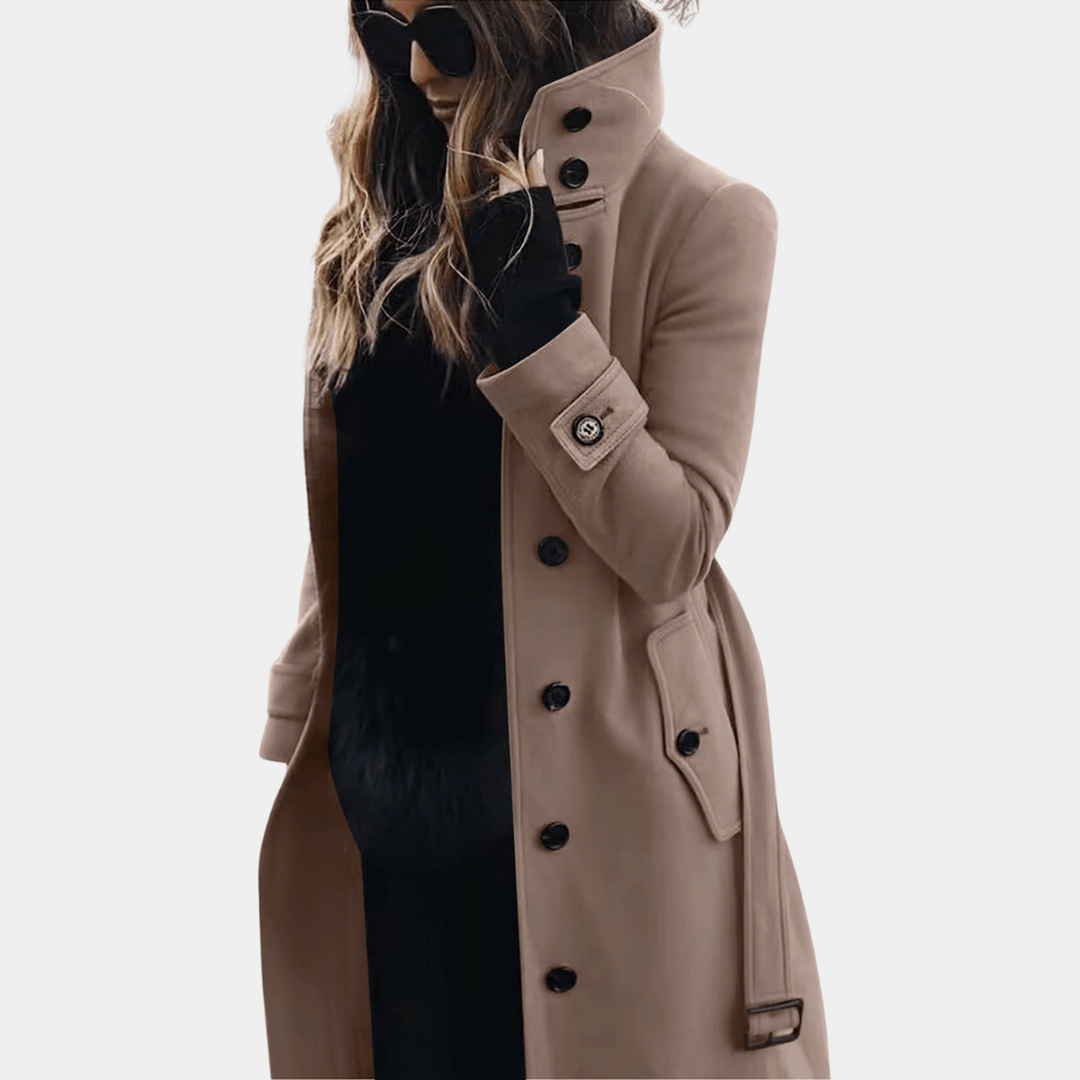 Ladies' classic long trench coat. Elegant double-breasted design, a sophisticated choice for winter outerwear.