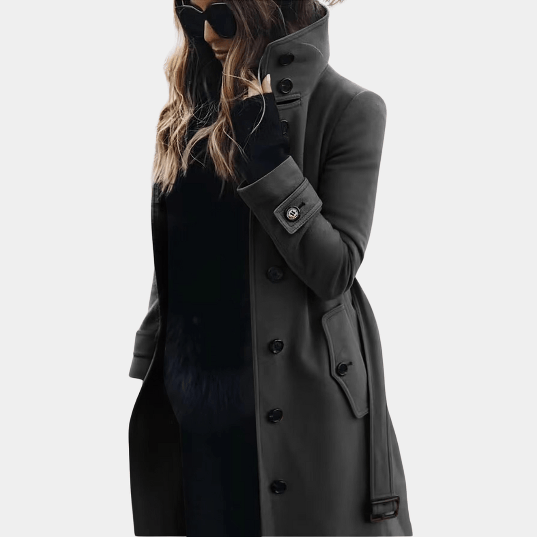 Women's elegant winter outerwear: a long trench coat. Classic double-breasted, tailored for sophisticated fashion.