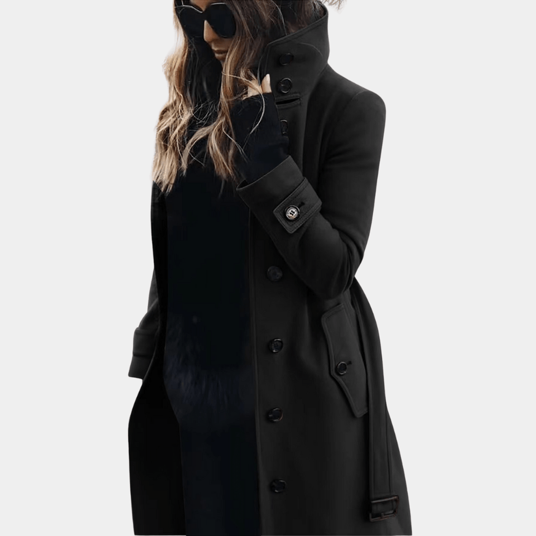 Women's elegant long trench coat. Classic double-breasted design, sophisticated winter outerwear with tailored fit.