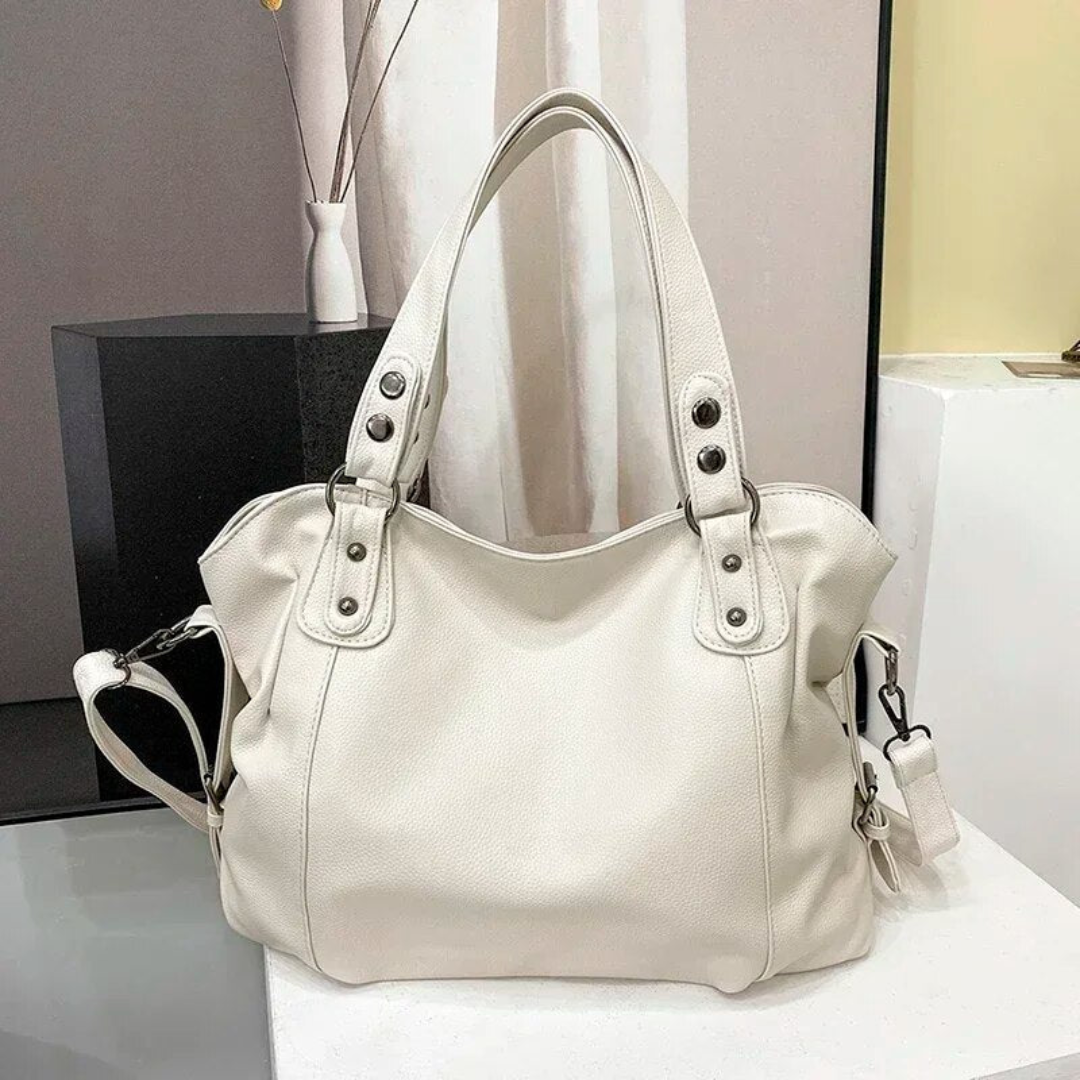 Black luxury leather shoulder bag for women. Elegant designer quality handbag, ideal for daily carry & fashion.