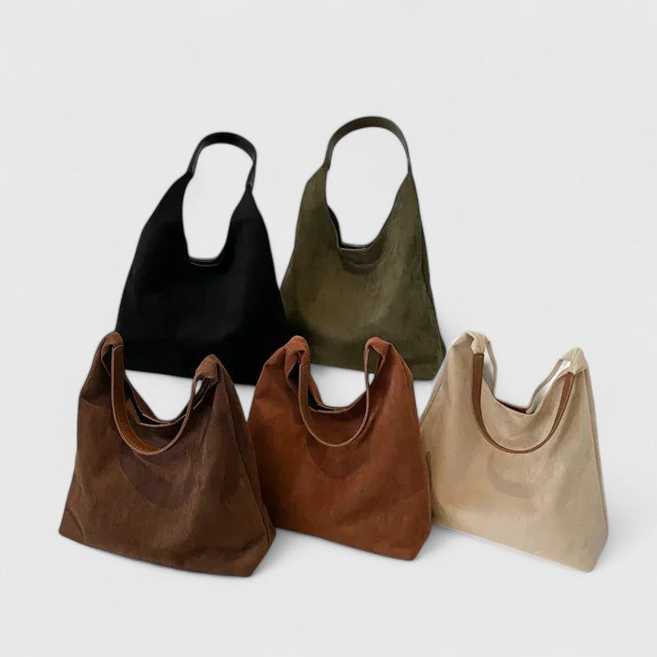 Elegant women's minimalist shoulder bag in vegan leather, perfect for everyday chic style and versatility.