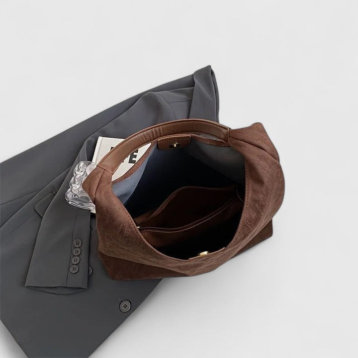 Minimalist vegan leather shoulder bag, an elegant women's crossbody for versatile everyday wear.
