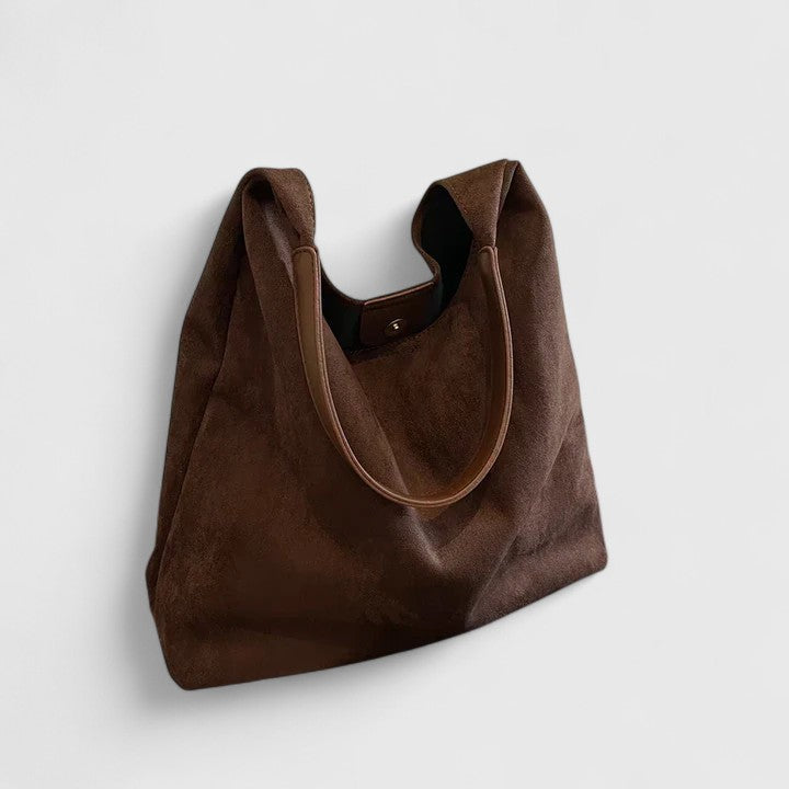 Clean design elegant women's shoulder bag. Minimalist vegan leather handbag, perfect chic everyday carry.