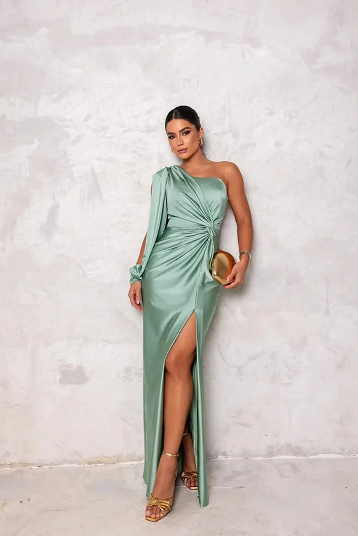 Stylish royal blue one-shoulder flowy gown, a beautiful choice for an elegant evening or party.